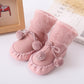 Pink baby winter floor socks with pom-pom ties and soft fuzzy cuffs