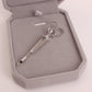 Silver hair clips set in a gray box, long bar with curled ring ornaments
