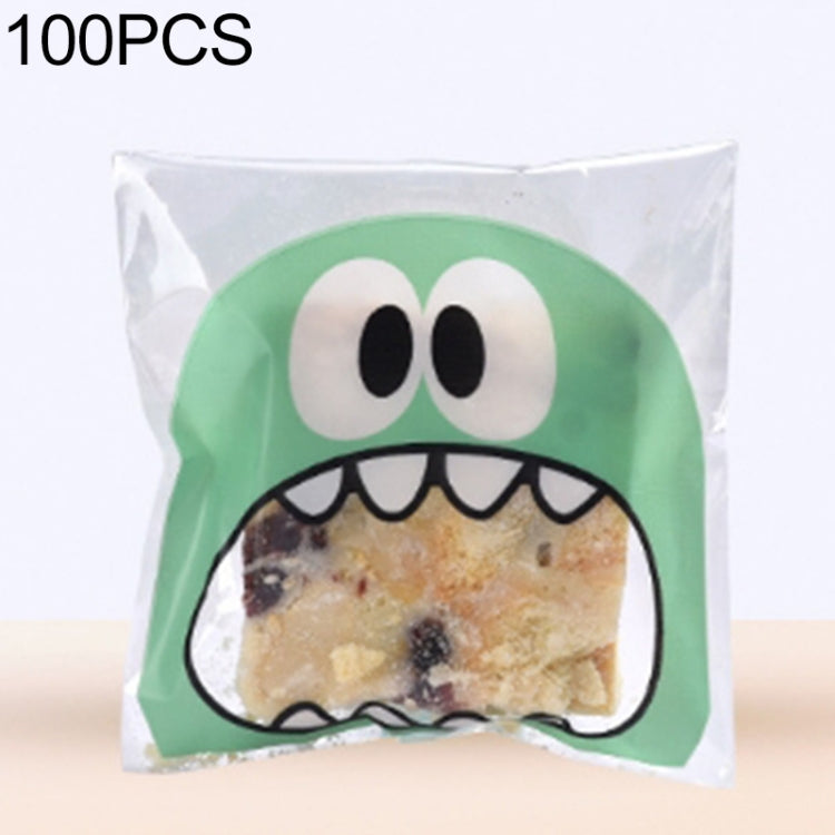 Green monster-mouth cookie gift plastic bag with printed face and pastry inside