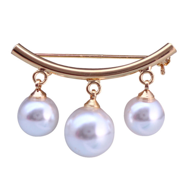 Gold-tone curved brooch with three dangling white pearls and pin backing