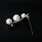 Silver-tone pearl bar brooch with three white pearls and pin clasp