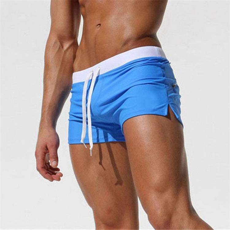 Men's royal blue swim shorts with drawstring waist and side pockets