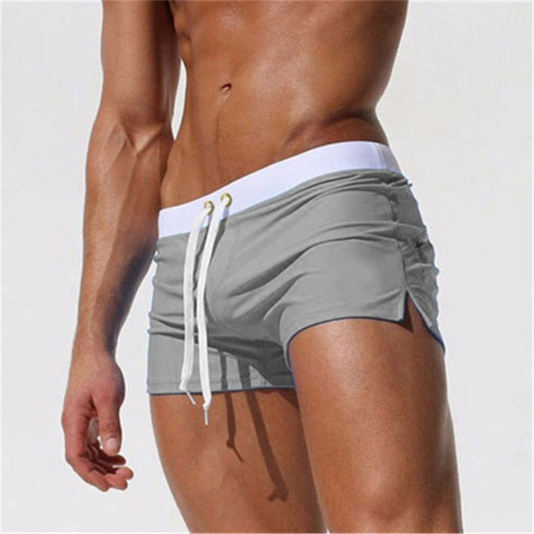 Gray swim shorts showing side seam and drawstring waistband with back pocket