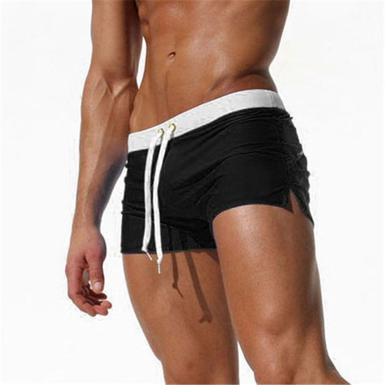 Men's black swim shorts with white waistband stripe and white drawstring cords