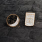 Set of enamel brooch pins: round moon constellation pin and “Good Vibes” bottle pin.