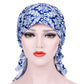 Stretch printed turban hat with long side tail, blue and white damask pattern