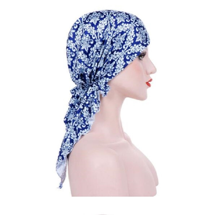 Stretch printed turban hat with long drape tail, blue and white damask print