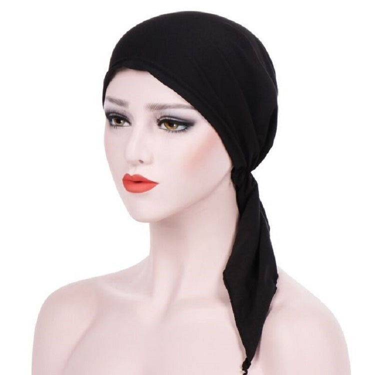 Black curved wrap cap turban hat with side tie tail and gathered knot at the back
