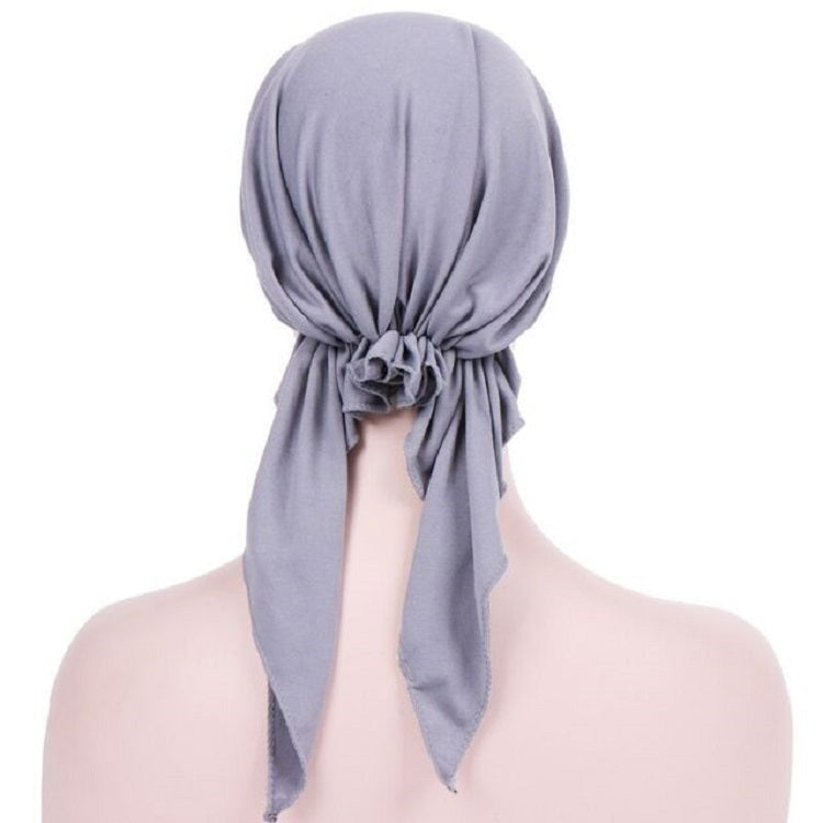 Light gray curved wrap cap turban hat with gathered back knot and hanging tail