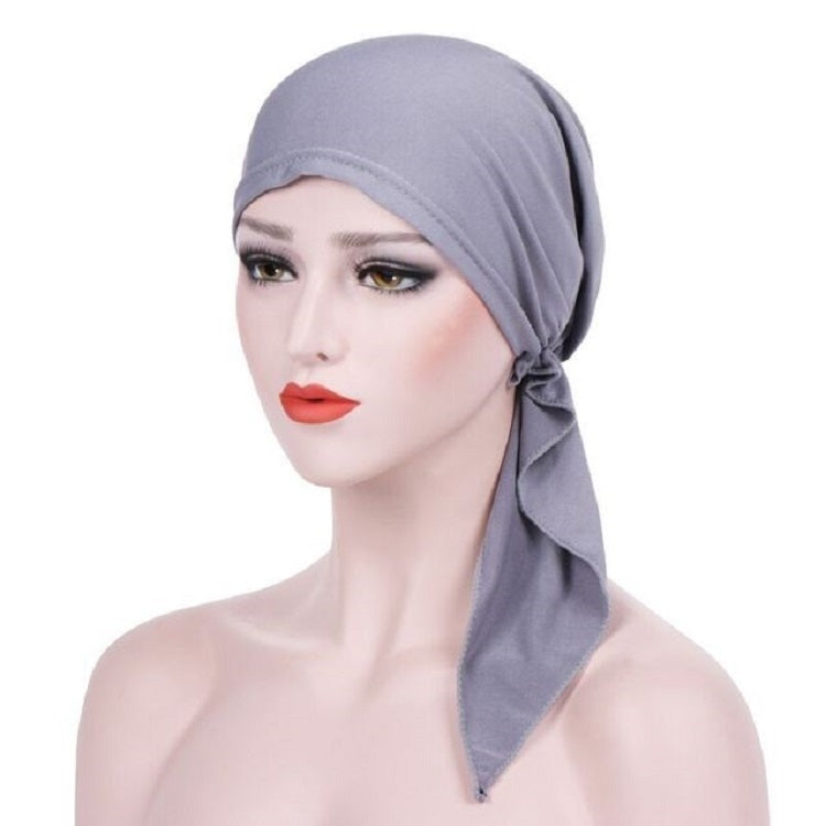 Gray curved wrap cap turban hat with side knot and angled hanging tie tail