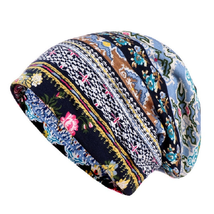 Rolled cotton hat wrap with multicolor floral-and-stripe print on blue fabric