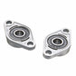 Two zinc alloy bearing housings with black inner bearings, separated view