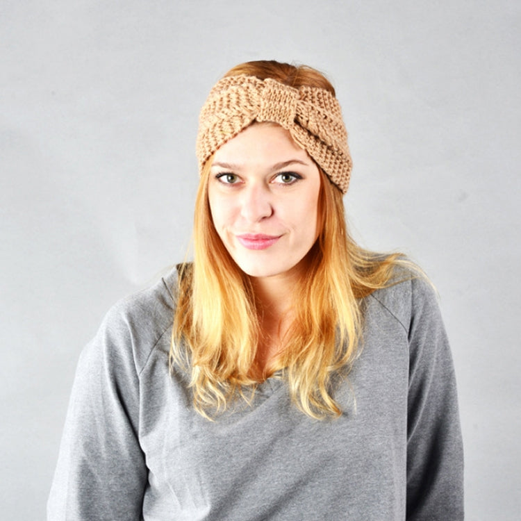 Beige knitted turban headband with wide knot bow, textured crochet knit, stretch hair wrap