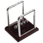 Newton pendulum collision ball set with chrome arches, hanging steel balls, dark base