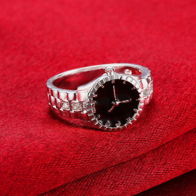 Silver-tone watch ring with black dial, crystal bezel and side link details