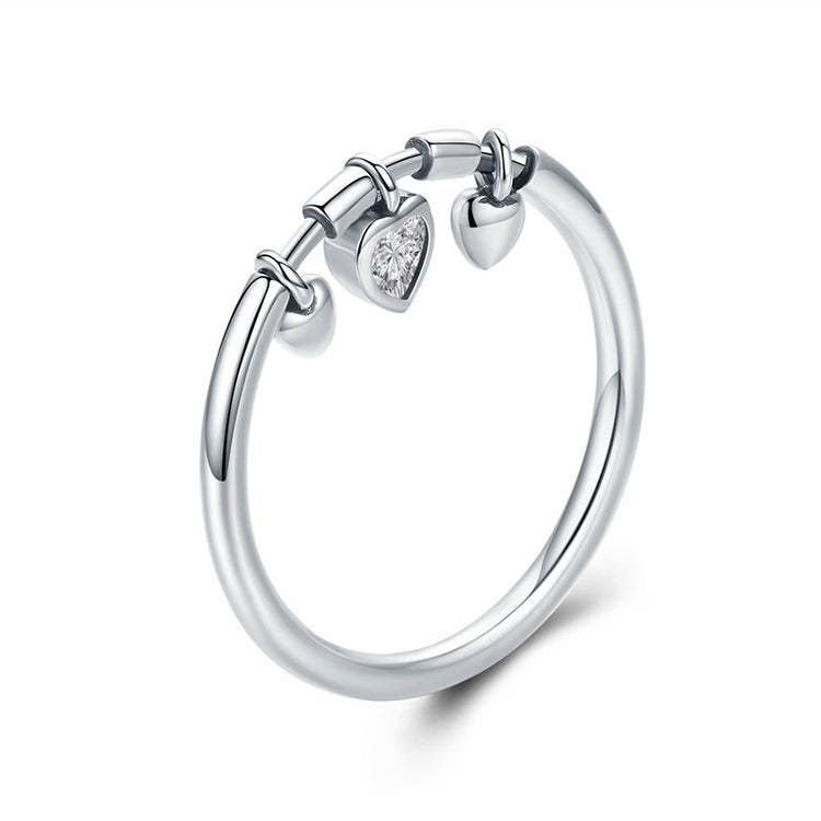 Sterling silver heart CZ ring with three heart charms in a polished band