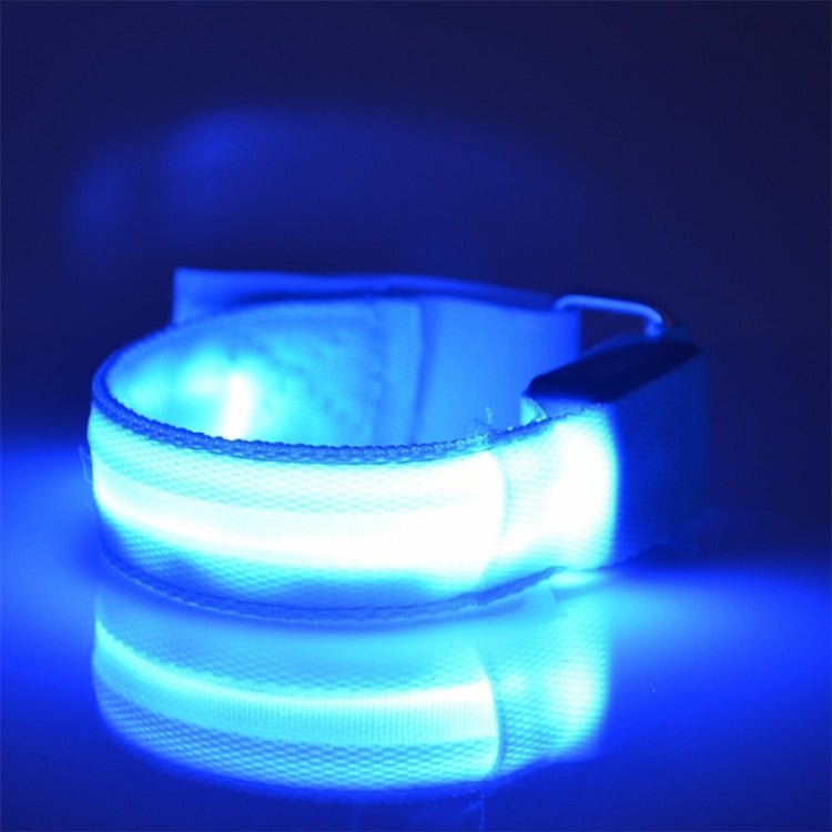 Light blue glowing LED light armband bracelet on an adjustable strap