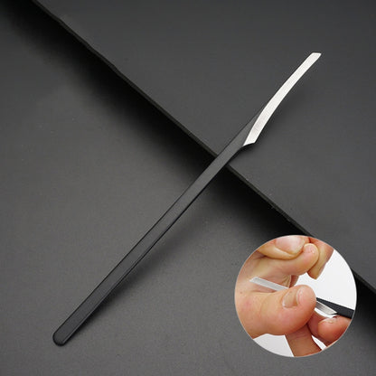 Nail grooming scraper with long black handle and angled metal tip