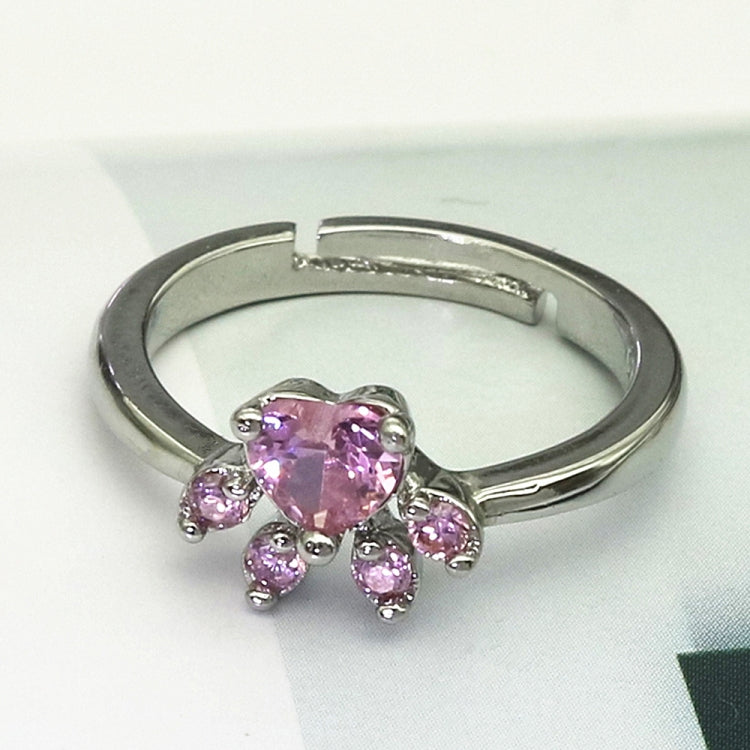 Pink crystal cat-claw adjustable ring on silver-tone open band