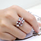 925 sterling silver ring with red center and clear crystals, worn on hand