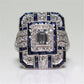 Square crystal zircon engagement ring with blue accents and a clear center stone