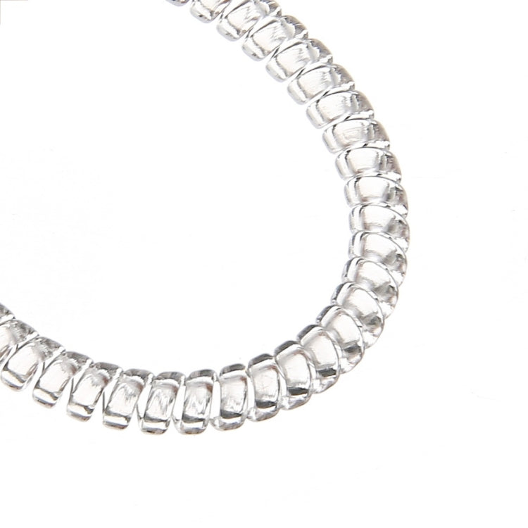 Close-up of the silver-tone coiled strip used to reduce ring size