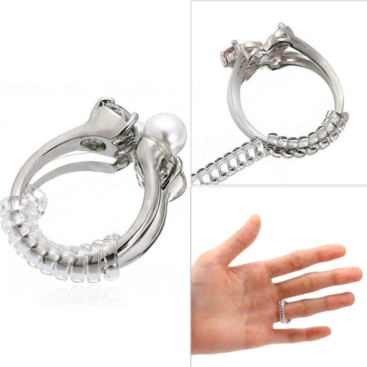 Ring size adjuster spiral chain connected to a ring with a metal clasp
