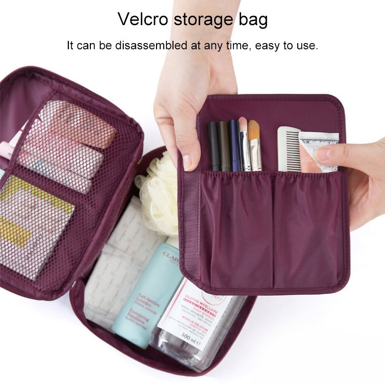 Burgundy zippered toiletry organizer bag open with mesh pocket and elastic slots.