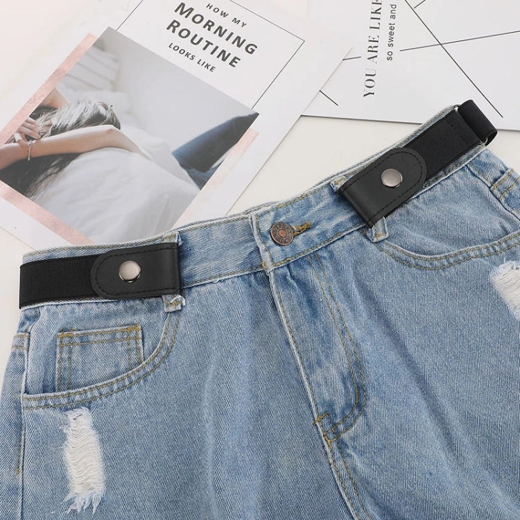 Black PU leather elastic waistband on blue denim jeans with snap closure