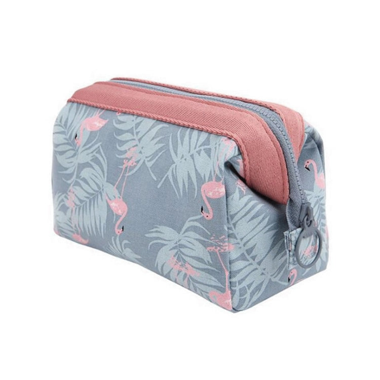 Flamingo patterned cosmetic bag with pink-and-gray fabric and side zipper pull, travel size