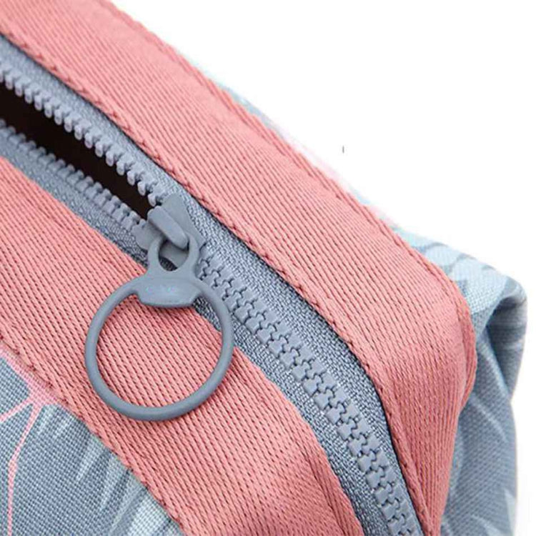 Pink-trim cosmetic bag zipper pull on gray fabric, detailed zip closure