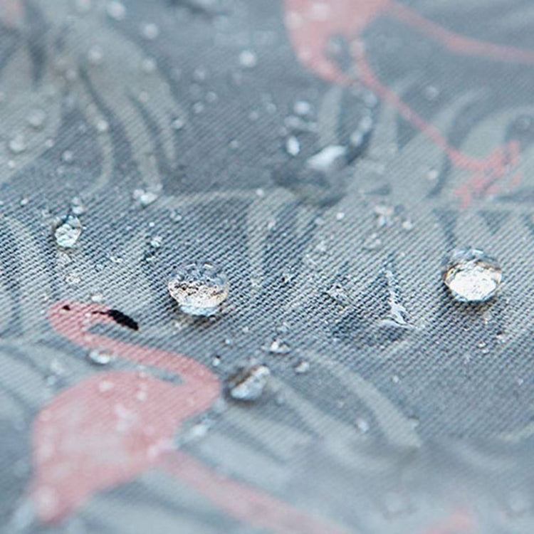 Water-resistant cosmetic bag fabric with flamingo print and water droplets, close-up