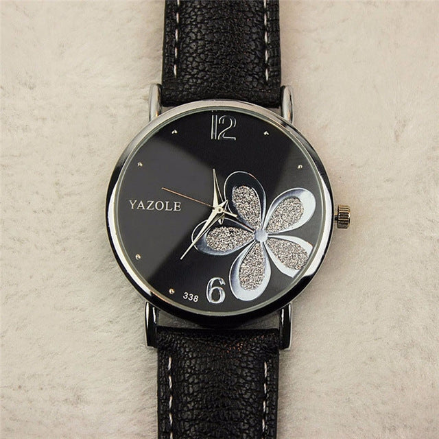 Ladies quartz watch with black leather strap, silver case, black dial with glitter four-leaf clover