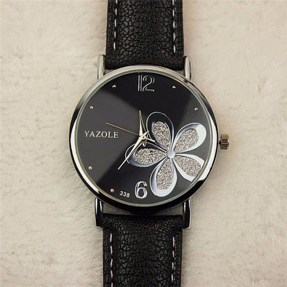 Ladies quartz watch with black leather strap, silver case, black dial with glitter four-leaf clover
