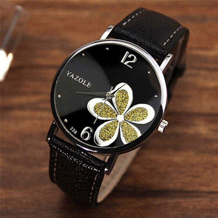 Ladies quartz watch with black leather strap, silver case, black dial with gold glitter four-leaf clover