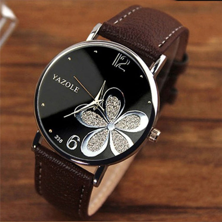Ladies quartz watch with brown leather strap, silver case, black dial with glitter four-leaf clover