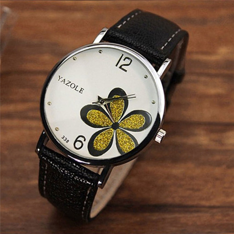 Ladies quartz watch with black leather strap, silver case, white dial with gold glitter four-leaf clover