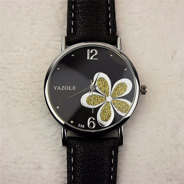 Ladies quartz watch with black leather strap, silver case, black dial with gold glitter four-leaf clover