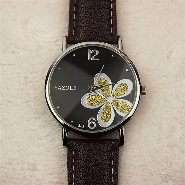 Ladies quartz watch with brown leather strap, silver case, black dial with gold glitter four-leaf clover