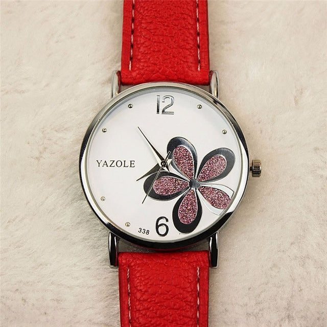 Ladies quartz wristwatch with four-leaf clover dial and red leather-look strap