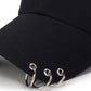 Black baseball cap brim close-up with metal ring adjustable strap