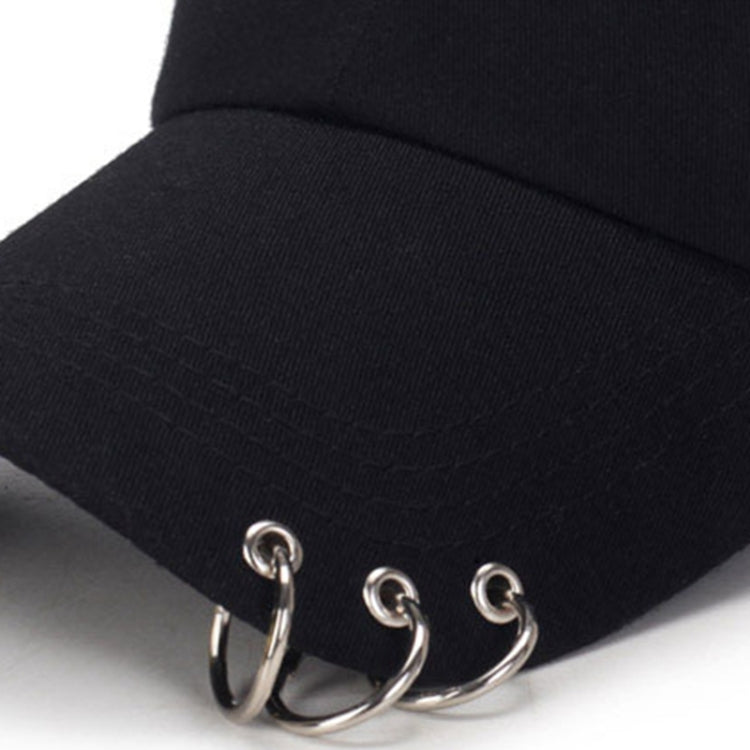 Black baseball cap brim close-up with metal ring adjustable strap