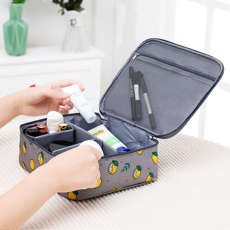 Dark blue cosmetic bag with lemon print, open top mesh pocket, and divider compartments