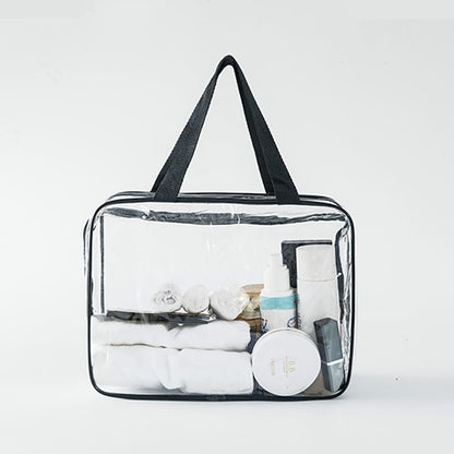 Clear PVC travel organizer pouch with black handles and zipper, toiletries inside