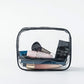Clear PVC zipper pouch with black trim, holding makeup and beauty items