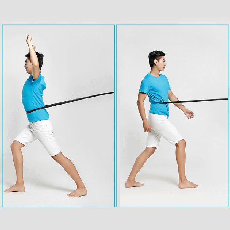 Latex resistance band in use for stretching, held across arms during exercise