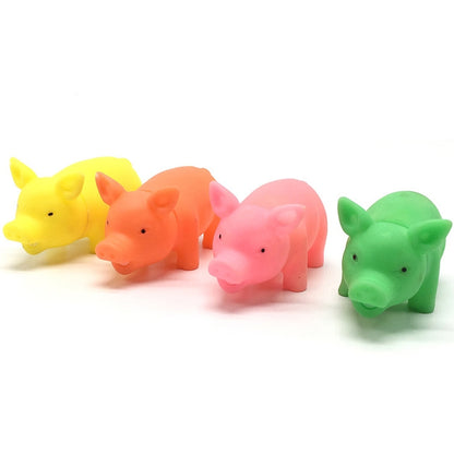 Set of rubber squeaky pig-shaped dog toys in yellow, orange, pink, and green
