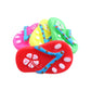 Red rubber squeaky dog chew toy with blue pattern and round white paw accents