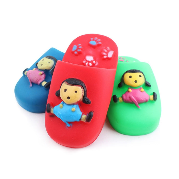 Three colorful rubber squeaky chew toys shaped like slippers with cartoon characters