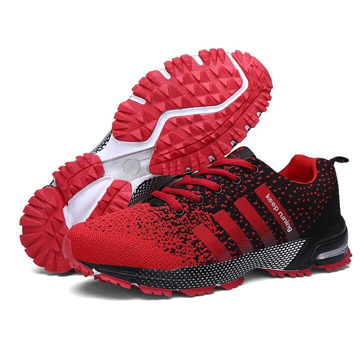 Red and black trekking sneakers with white side stripe and red treaded outsole